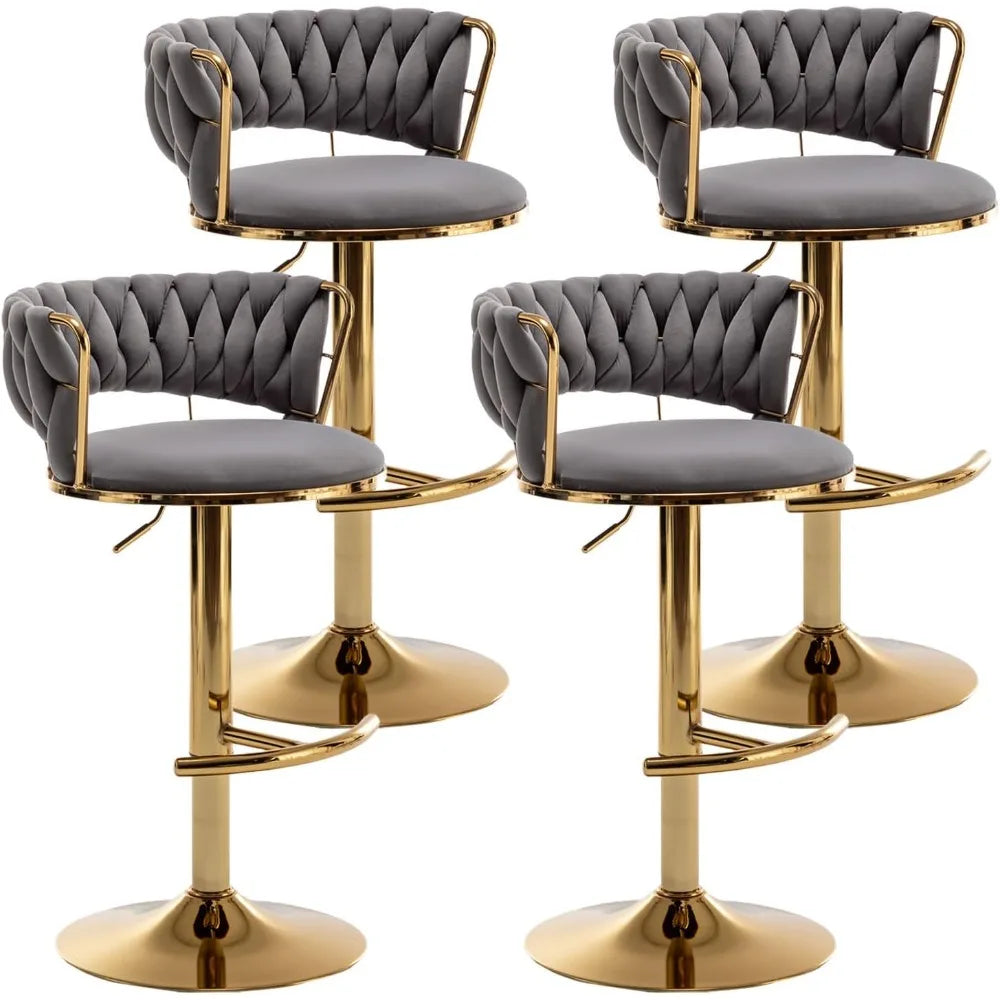 The Morsale Counter Height Velvet Bar Stools Set of 4, with gold metal frames and bases, embody a minimalist modern design. Each stool features a dark gray tufted backrest and cushioned seat with a footrest, ideal for residential or commercial use.