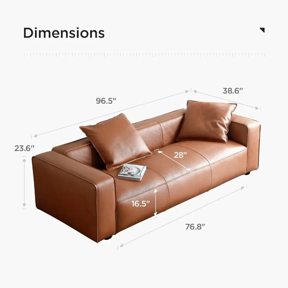 The Morsale Stefano Genuine Leather Lounge Sofa, featuring a modern design in brown leather and paired with two matching cushions, enhances your living room. It measures 96.5" L x 38.6" D, with a seat depth of 28", seat height of 16.5", and armrests at 23.6". A book sits invitingly on the cushion.