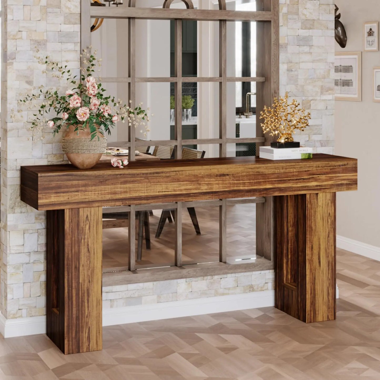 The Morsale Farmhouse 63-Inch Entryway Console Table exudes retro nostalgia against a stone wall. Topped with a floral vase and antique metal tree sculpture, it reflects a dining room setup, while the light wood herringbone floor enhances its charm.