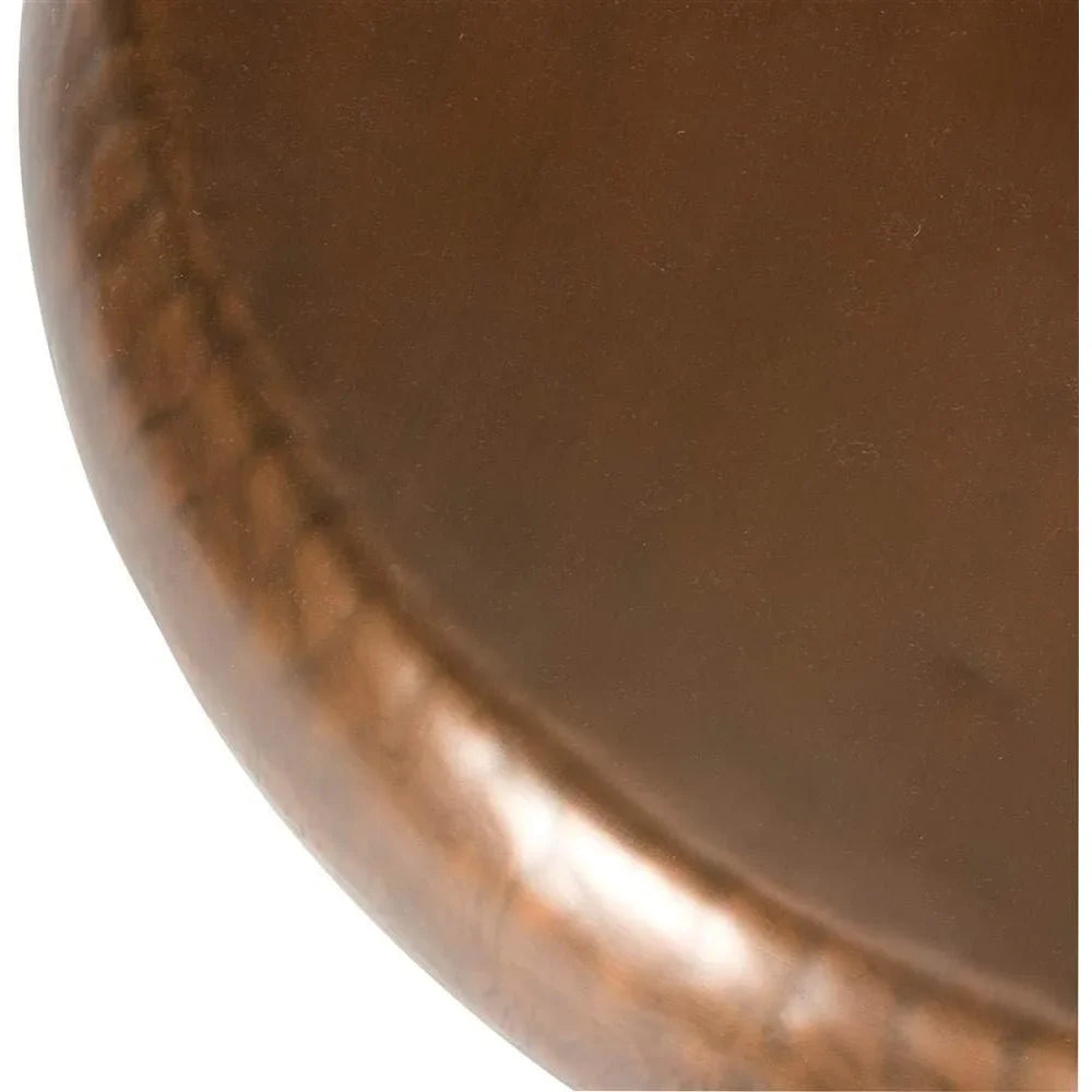 Modern style radiates from the 39" Copper Coffee Table by Morsale, featuring a smooth brown leather surface accented with evenly spaced stitches that form a textured pattern along its circular edge, enhanced by a slight sheen.