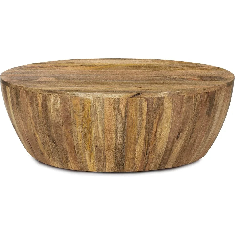 The Morsale Mango Wood Goa Coffee Table features a round design with a smooth, flat top and natural wood grain texture. Its slightly tapered base enhances its modern style, while the varied wood shades add depth and character.