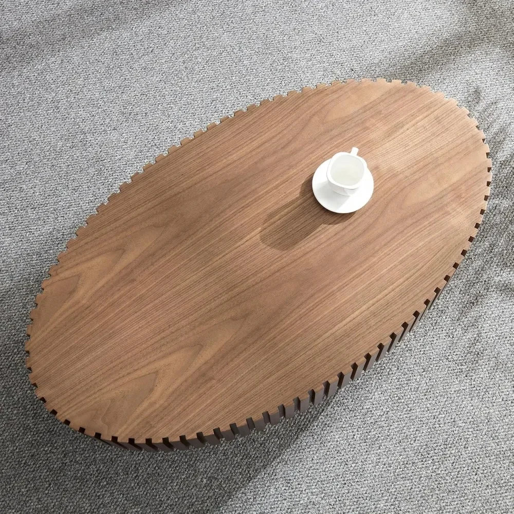 The Morsale 43" Living Room Coffee Table features a natural finish and an oval shape, resting on a light gray carpet. A white cup and saucer sits on its surface casting a shadow. Its serrated edges add character to this US-origin, chemical-free wooden piece.