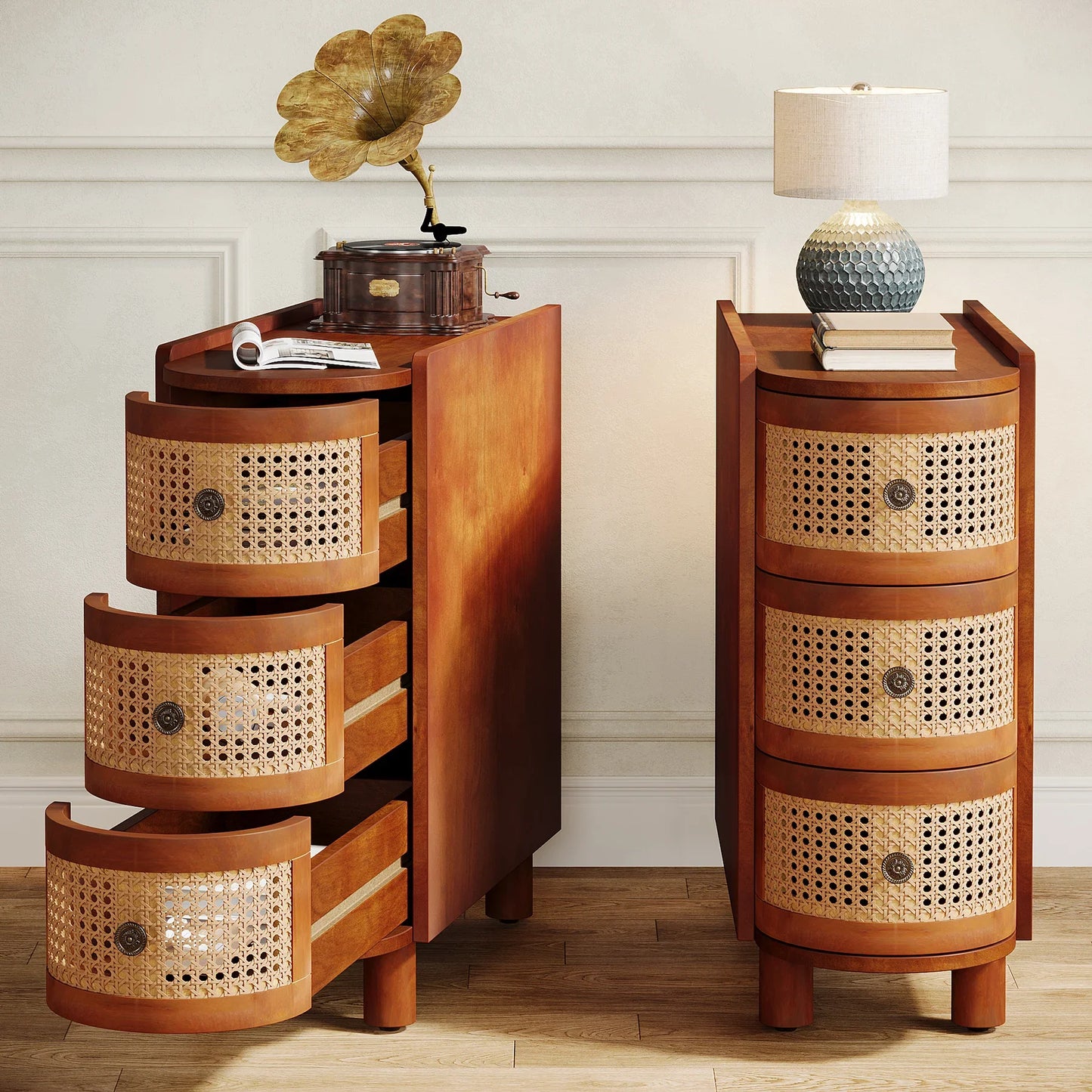 Two Morsale Irvine Solid Wood Side Tables with three wicker-front drawers each are placed side by side. The left one's drawers are open, while the right holds a lamp, plant, and books on top. Both feature a vintage finish and rest against a light-colored wall.