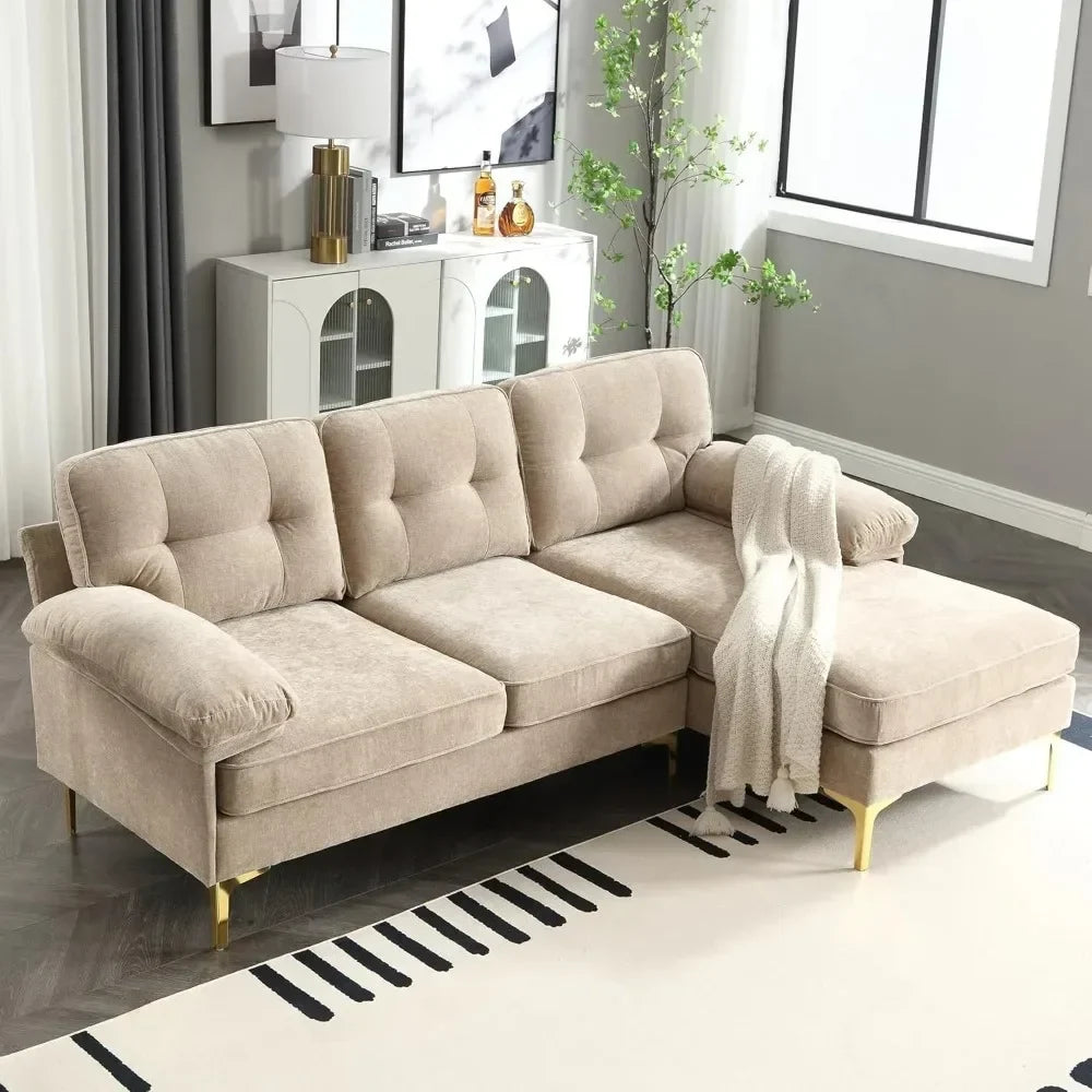 A modern living room showcases an 83" Morsale sectional sofa with a chaise in luxury chenille fabric adorned with a gray throw. Behind it, a white cabinet holds decorative items. Nearby are a tall lamp and potted plant, while a large window floods the space with natural light.