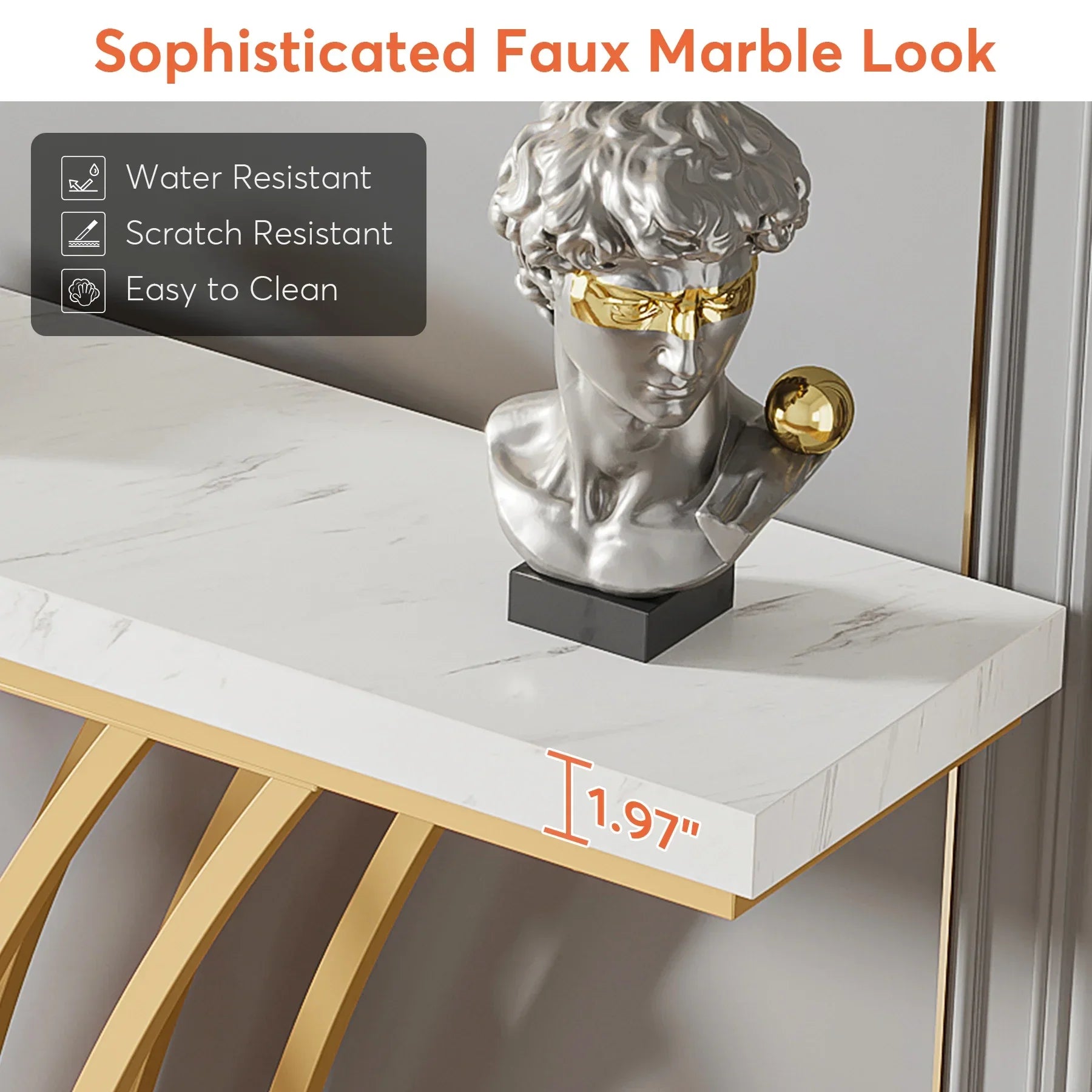 The Morsale Bassett Entryway Table, featuring a sophisticated faux marble top and gold legs, is stylishly adorned with a silver bust featuring a gold eye mask and earring. Its highlights include "Water Resistant," "Scratch Resistant," "Easy to Clean," and dimensions of "1.97''.
