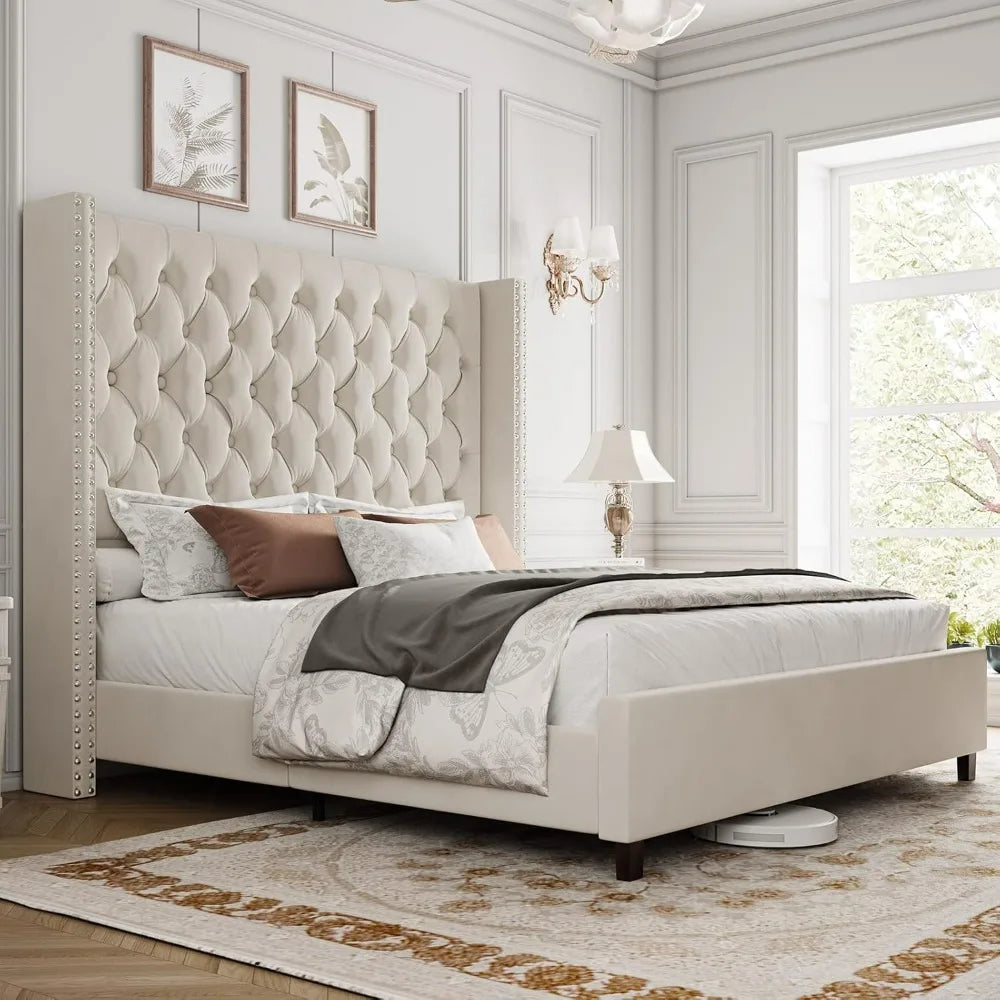 A luxurious bedroom features a Morsale Velvet Tufted Bed With Headboard, white and gray bedding, and decorative pillows. A cozy rug covers the wood floor. A bedside table with a lamp sits by the large window, and a European-made robotic vacuum is partially visible under the bed.