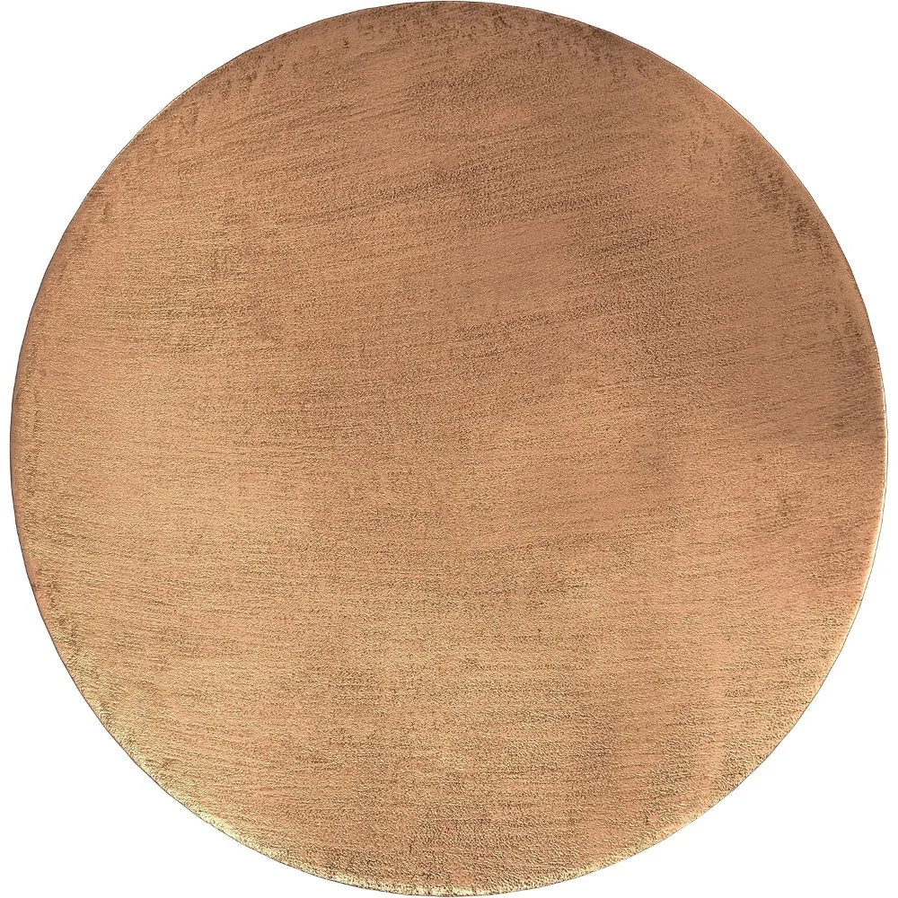 The Morsale Antique Copper Metal Coffee Table features a round, metallic plate with a brushed, textured surface. Its warm, reflective finish beautifully highlights light and shade variations, reminiscent of an antique copper table.
