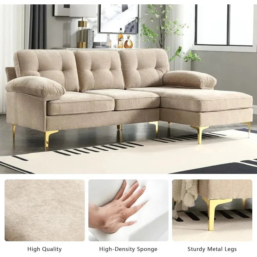 The Morsale 83" Sectional Sofa with Chaise, featuring tufted beige cushions, soft armrests, a high-density sponge, and sturdy metal legs, is beautifully displayed in a modern living room with large windows. A chic rug adds to the stylish ambiance beneath this elegant piece of furniture.